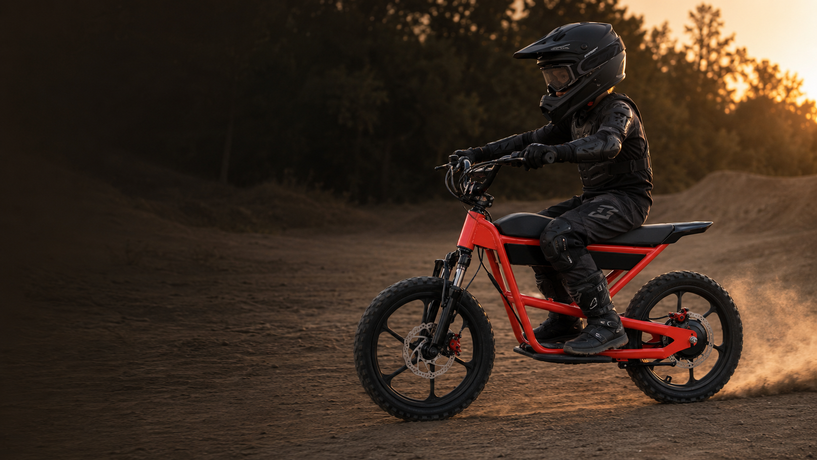 Young rider in protective gear riding a ZEROOXRIDE electric dirt bike outdoors